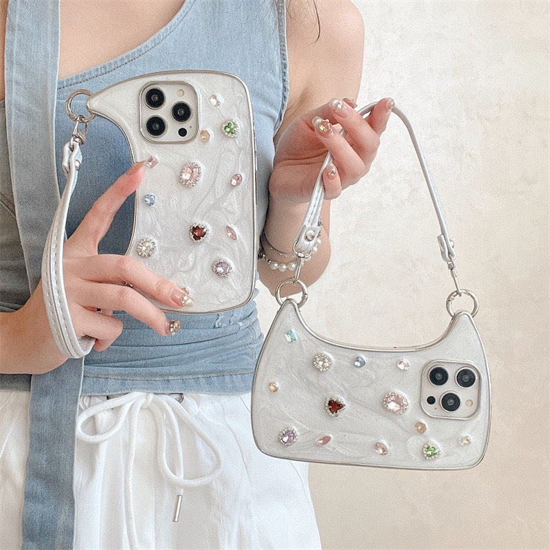 🥳2026 HOT SALE🥳💞50K+ SOLD!💥✨💎 50% OFF! Creative Phone Case with Top Handle – Synthetic gemstones add luxury shine. Easy carry handle, precise cutouts. Durable TPU protection. Transform your phone into a chic accessory. 📱👜