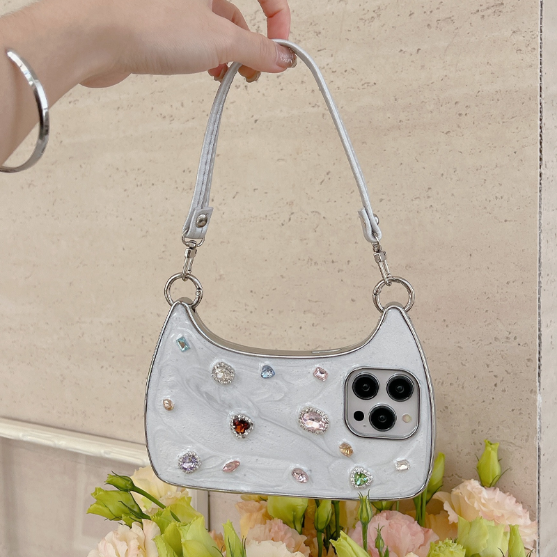 🥳2026 HOT SALE🥳💞50K+ SOLD!💥✨💎 50% OFF! Creative Phone Case with Top Handle – Synthetic gemstones add luxury shine. Easy carry handle, precise cutouts. Durable TPU protection. Transform your phone into a chic accessory. 📱👜