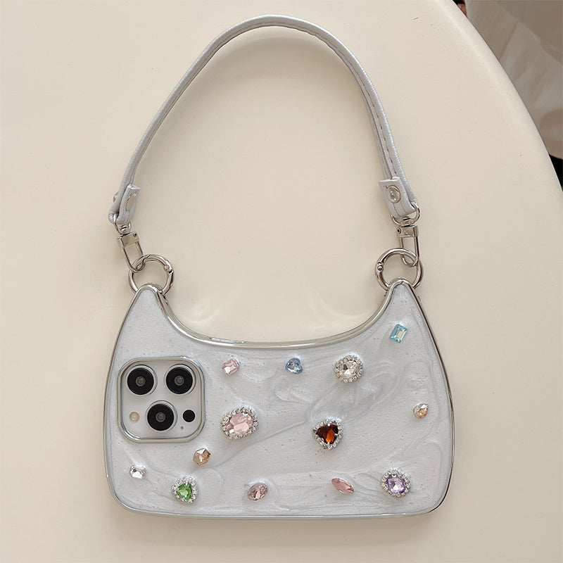 🥳2026 HOT SALE🥳💞50K+ SOLD!💥✨💎 50% OFF! Creative Phone Case with Top Handle – Synthetic gemstones add luxury shine. Easy carry handle, precise cutouts. Durable TPU protection. Transform your phone into a chic accessory. 📱👜