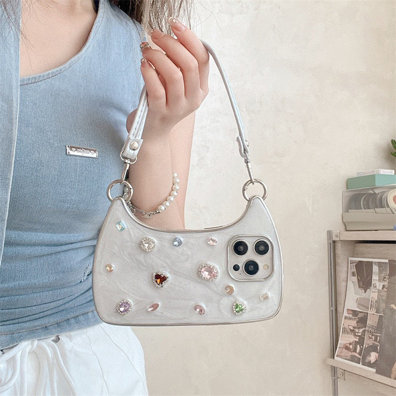 🥳2026 HOT SALE🥳💞50K+ SOLD!💥✨💎 50% OFF! Creative Phone Case with Top Handle – Synthetic gemstones add luxury shine. Easy carry handle, precise cutouts. Durable TPU protection. Transform your phone into a chic accessory. 📱👜
